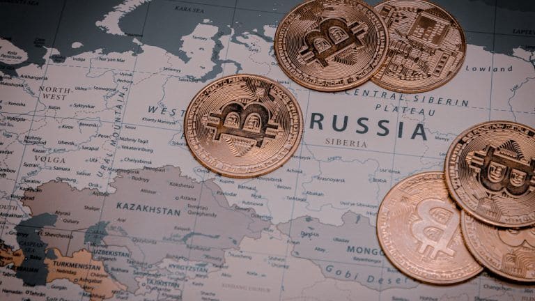 Illustration of Russian ruble and cryptocurrency symbols with a map of Russia in the background